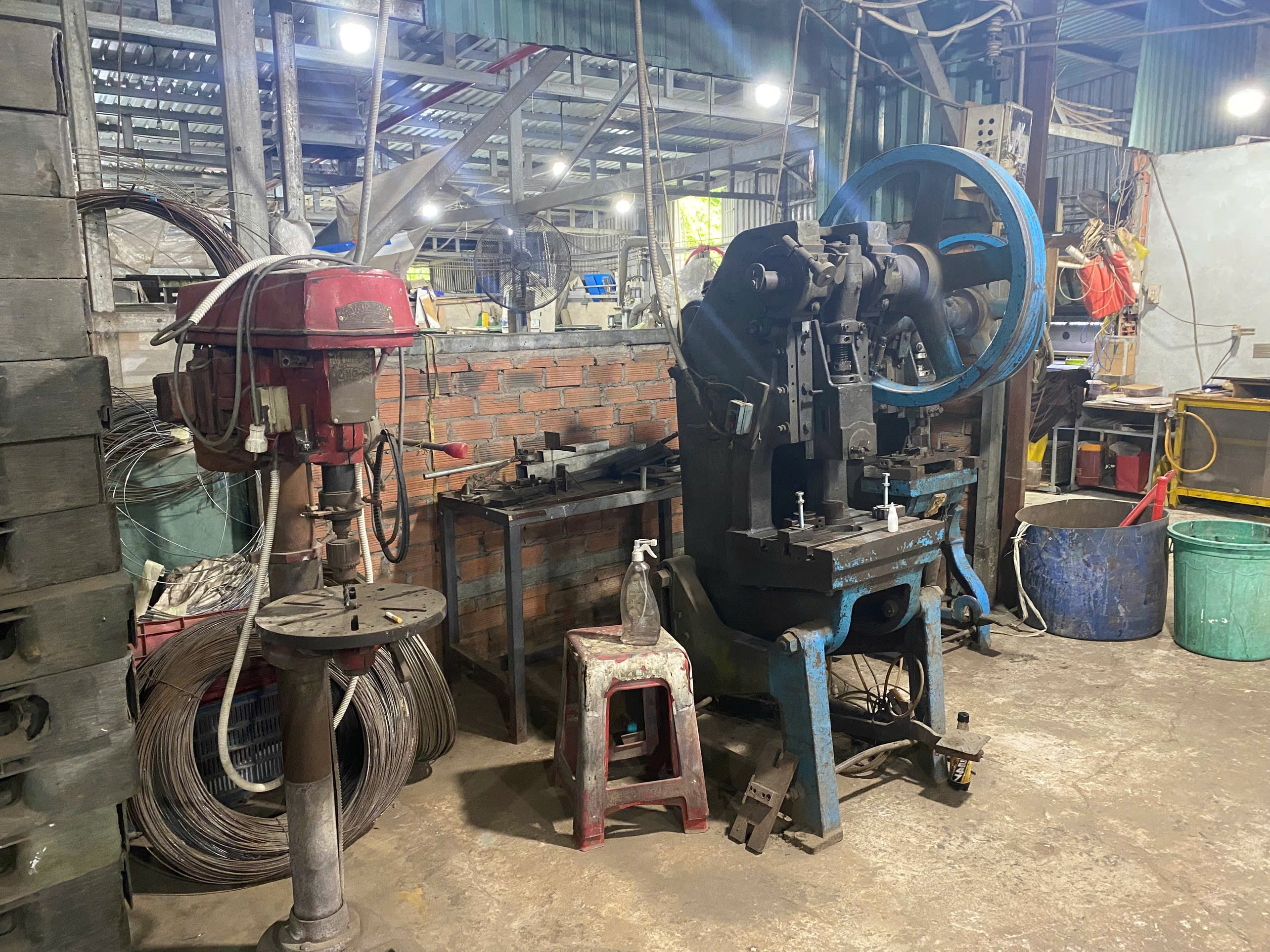 Drilling machine and stamping machine